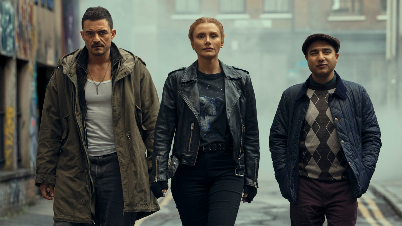 (L to R) Orlando Bloom as “Marlon,” Bryce Dallas-Howard as “Kat,” and Nick Mohammed as “Hugh” in the action comedy 'Deep Cover'. Photo courtesy of Peter Mountain/ Metronome Film.