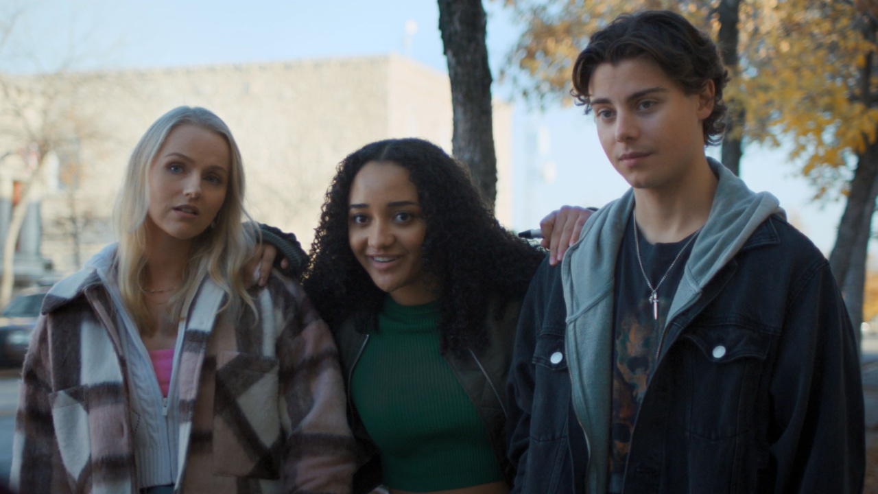 (L to R) Cassandra Potenza, Verity Marks, and Carson MacCormac in Eli Craig’s 'Clown in a Cornfield.' Courtesy of RLJE Films & Shudder. An RLJE Films & Shudder Release.