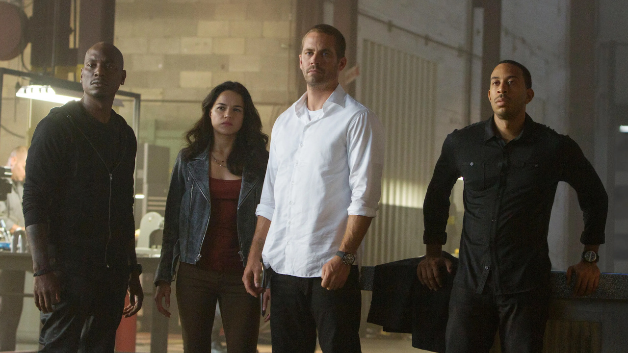 (L to R) Tyrese Gibson, Michelle Rodriguez, Paul Walker and Chris "Ludacris" Bridges in 'Furious 7'. Photo: Universal Pictures.