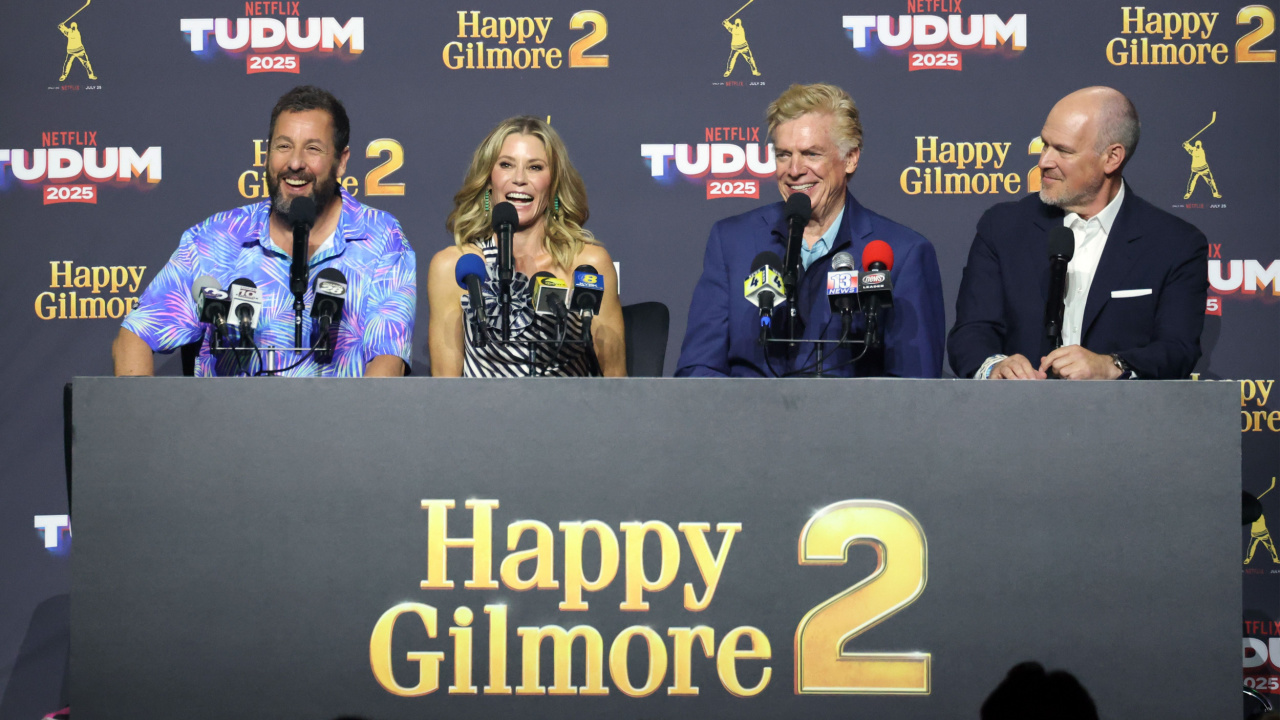 (L to R) Adam Sandler, Julie Bowen, Christopher McDonald, and Rich Eisen speak onstage during Netflix TUDUM 2025: The Live Event at The Kia Forum on May 31, 2025 in Inglewood, California. Photo: Amy Sussman/Getty Images for Netflix.
