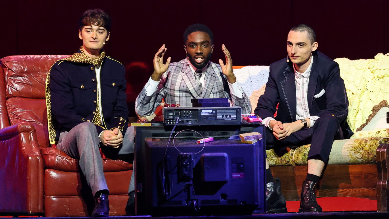 (L to R) Noah Schnapp, Caleb McLaughlin and Finn Wolfhard speak onstage during Netflix TUDUM 2025: The Live Event at The Kia Forum on May 31, 2025 in Inglewood, California. Photo by Amy Sussman/Getty Images for Netflix.