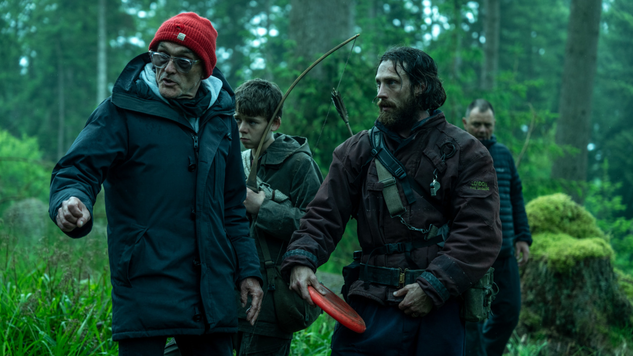 (L to R) Director Danny Boyle with Aaron Taylor-Johnson on the set of Columbia Pictures' '28 Years Later'. Photo: Sony Pictures. © 2024 CTMG, Inc. All Rights Reserved.