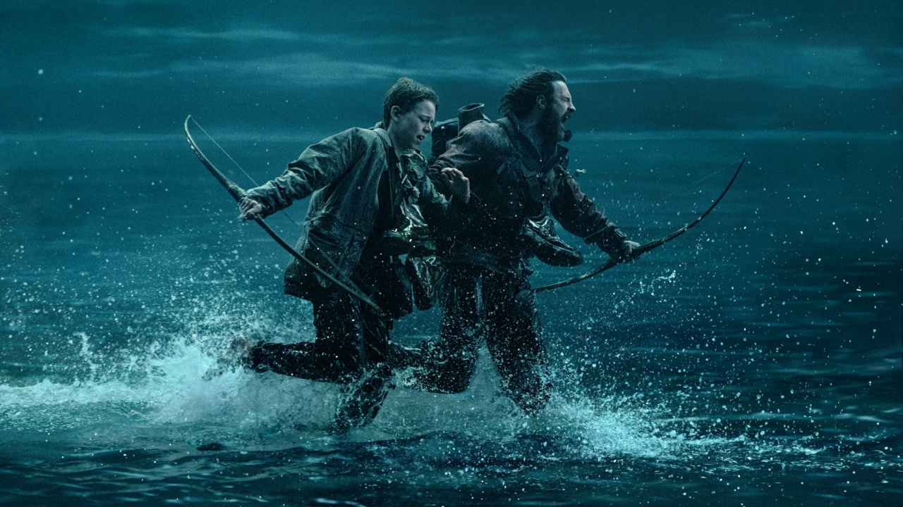 (L to R) Jamie (Aaron Taylor-Johnson) and his son Spike (Alfie Williams) being chased on the causeway in Columbia Pictures' '28 Years Later'. Photo: Sony Pictures. © 2024 CTMG, Inc. All Rights Reserved.