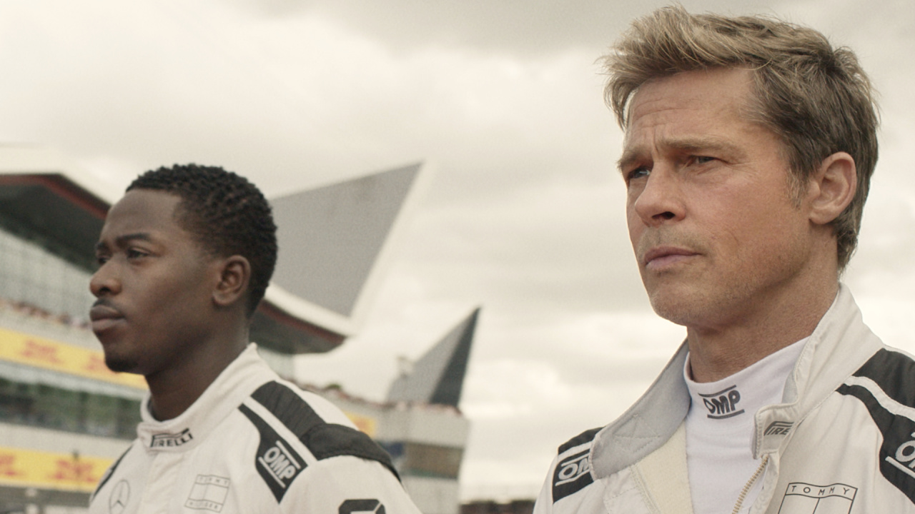 (L to R) Damson Idris as Joshua Pearce and Brad Pitt as Sonny Hayes in Apple Original Films’ 'F1', a Warner Bros. Pictures release. Photo Credit: Photo by Scott Garfield. Courtesy Warner Bros Pictures / Apple Original Films. Copyright: © 2025 Warner Bros. Entertainment Inc. All Rights Reserved.