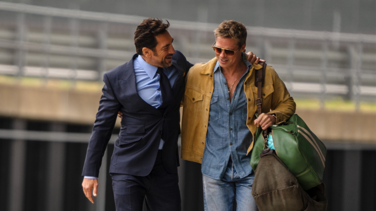 (L to R) Javier Bardem as Ruben Cervantes and Brad Pitt as Sonny Hayes in Apple Original Films’ 'F1', a Warner Bros. Pictures release. Photo Credit: Photo by Scott Garfield. Courtesy Warner Bros Pictures / Apple Original Films. Copyright: © 2025 Warner Bros. Entertainment Inc. All Rights Reserved.