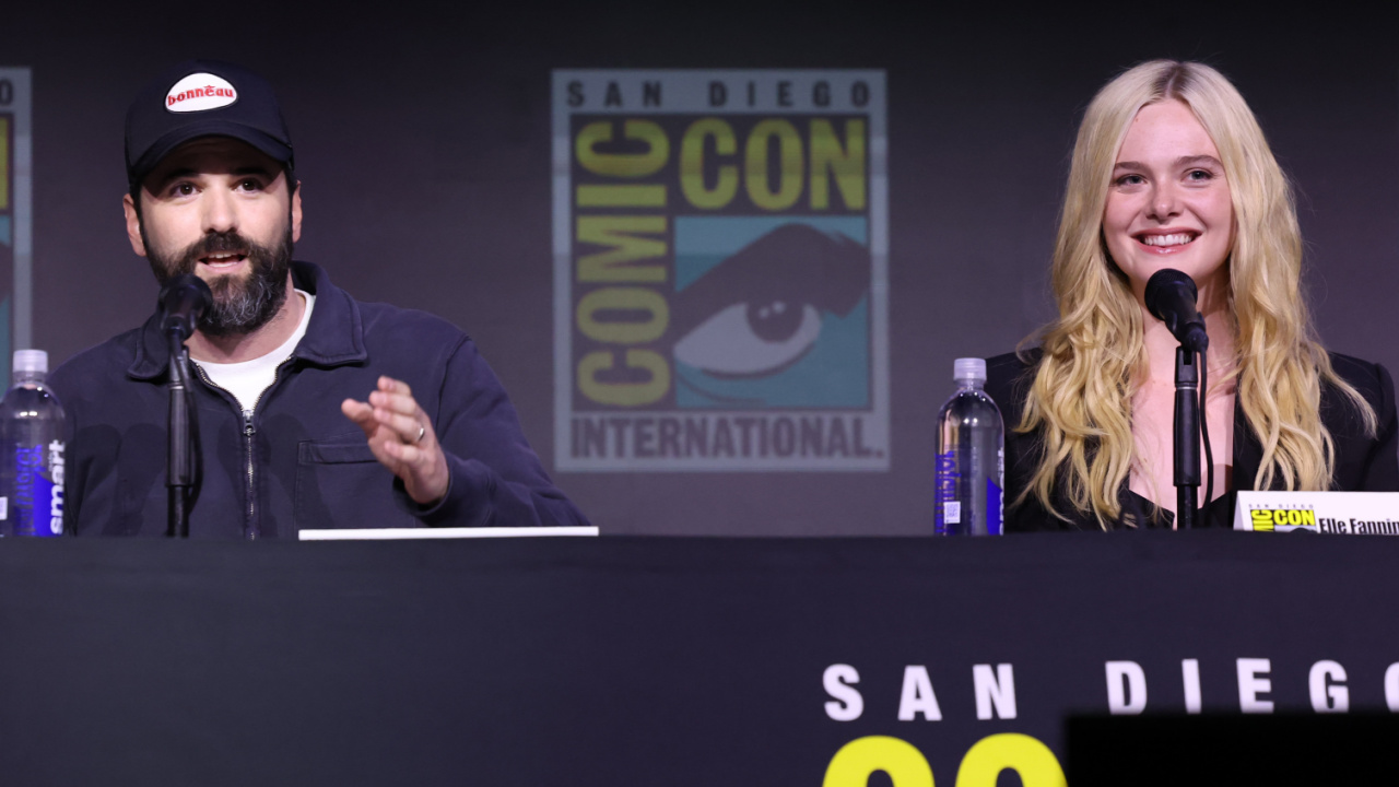 (L to R) Director Dan Trachtenberg and Elle Fanning at San Diego Comic-Con 2025 Hall H panel for 'Predator: Badlands'. Photo: Disney.