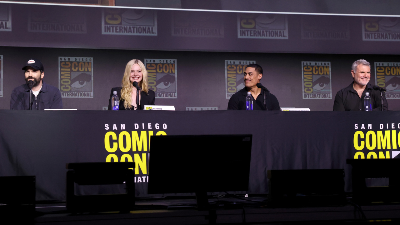 (L to R) Director Dan Trachtenberg, Elle Fanning, Dimitrius Schuster-Koloamatangi and Alec Gillis at San Diego Comic-Con 2025 Hall H panel for 'Predator: Badlands'. Photo: Disney.