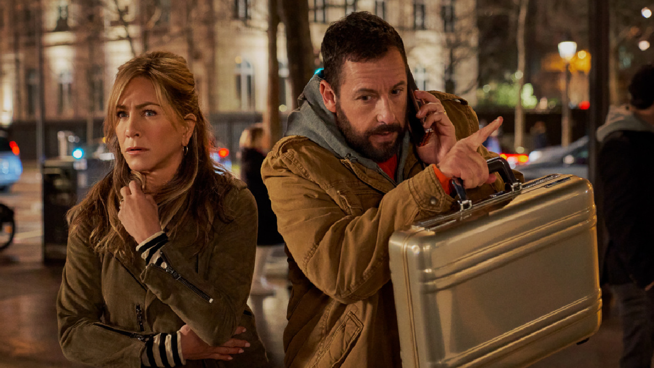 (L to R) Jennifer Aniston as Audrey Spitz and Adam Sandler as Nick Spitz in 'Murder Mystery 2.' Photo: Scott Yamano/Netflix © 2022.