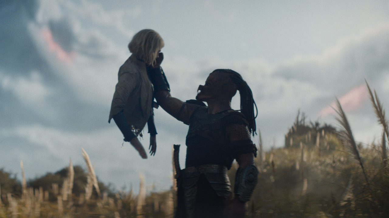 (L to R) Thia (Elle Fanning) and Dek (Dimitrius Schuster-Koloamatangi) in 20th Century Studios' 'Predator: Badlands' film. Photo courtesy of 20th Century Studios. © 2025 20th Century Studios. All Rights Reserved.