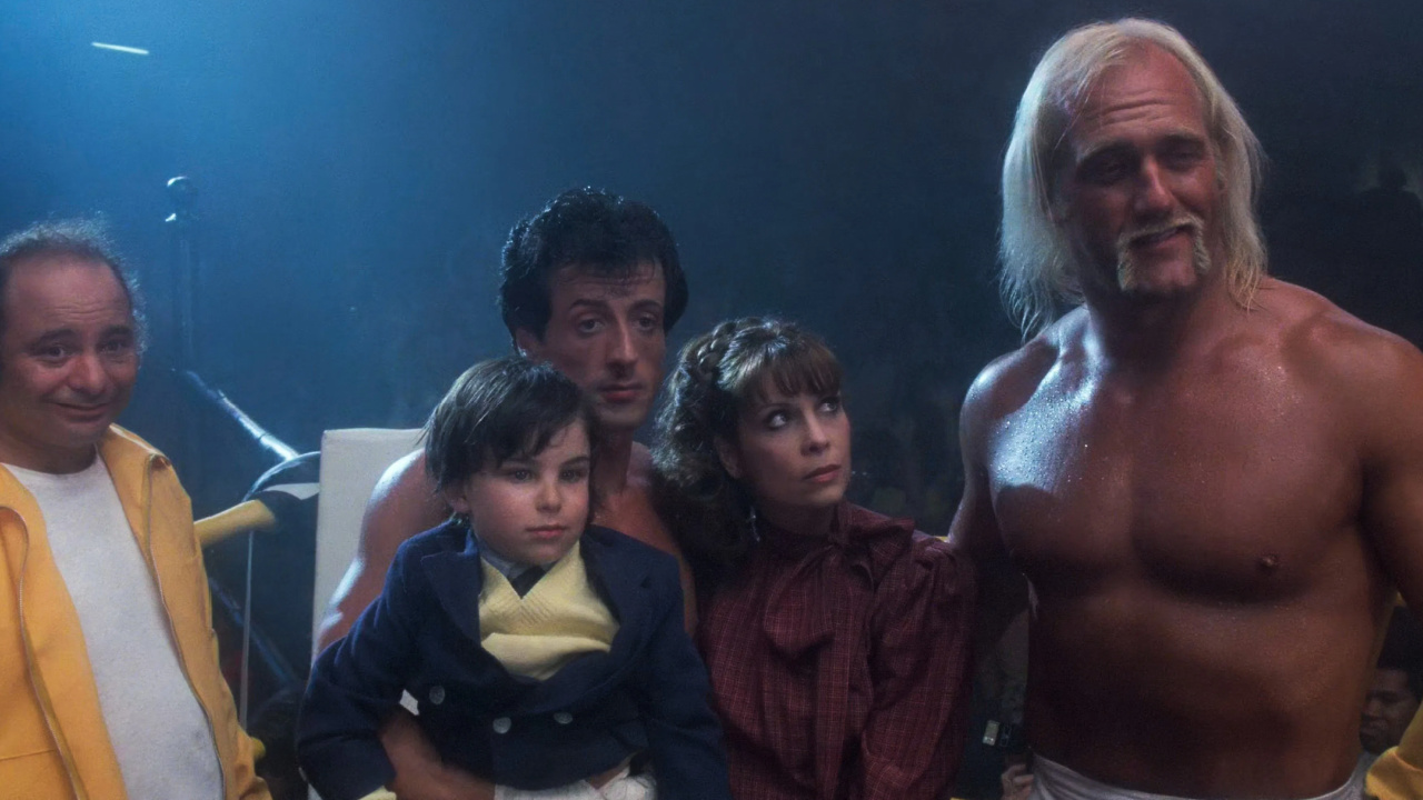 (L to R) Burt Young, Sylvester Stallone, Talia Shire and Hulk Hogan in 'Rocky III'. Photo: MGM/UA Entertainment Co.