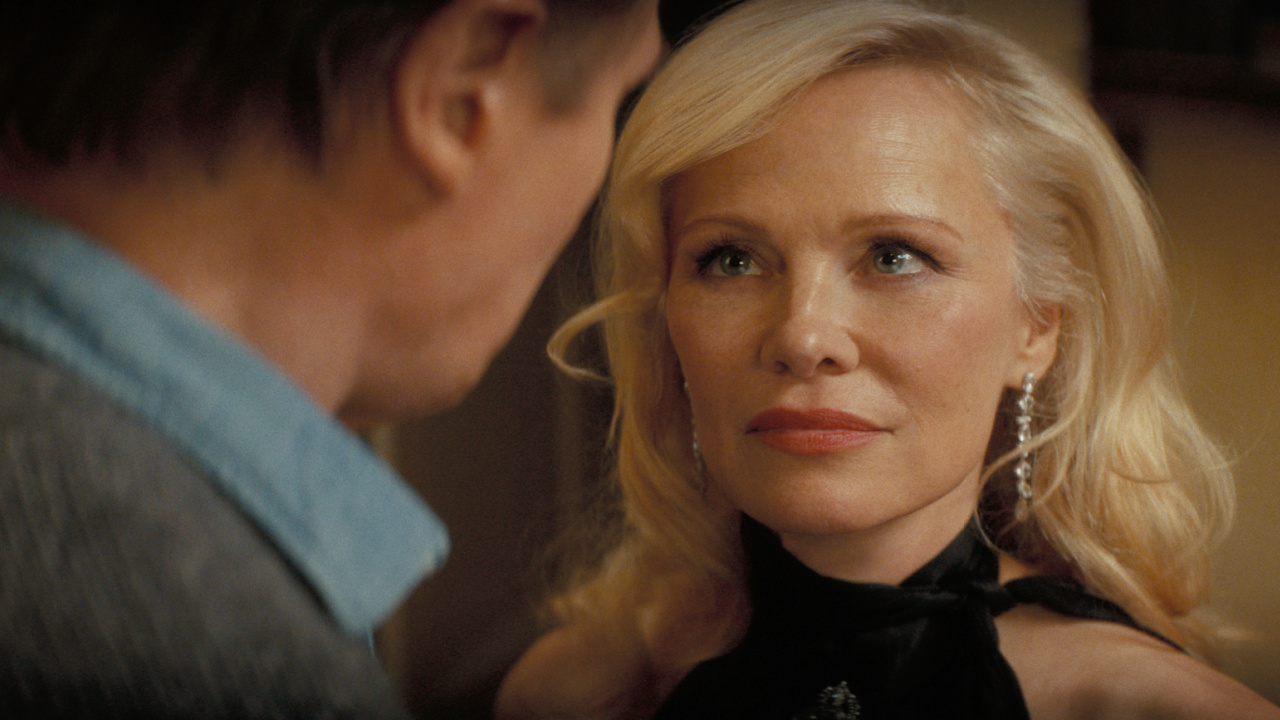 (L to R) Liam Neeson plays Frank Drebin Jr. and Pamela Anderson plays Beth Davenport in 'The Naked Gun' from Paramount Pictures.
