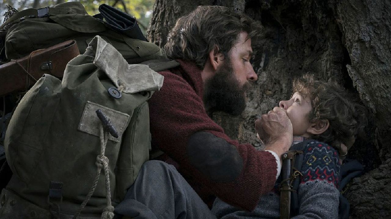 (L to R) John Krasinski as Lee Abbott, and Noah Jupe as Marcus Abbott in 'A Quiet Place.'