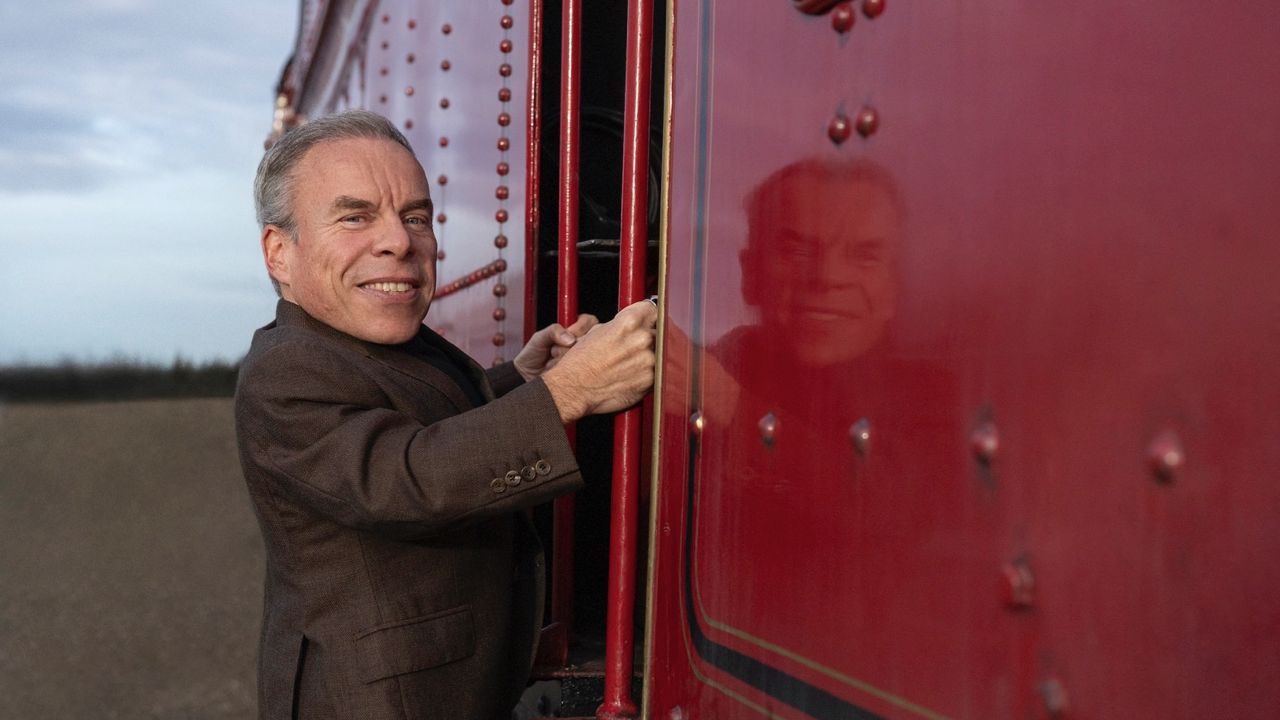 Warwick Davis with the Hogwarts 'Harry Potter' train. Photo: Aidan Monaghan/HBO.