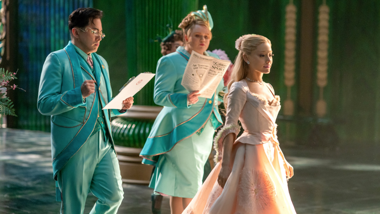 (L to R) Bowen Yang is Pfannee, Bronwyn James is Shenshen, and Ariana Grande is Glinda in 'Wicked For Good', directed by Jon M. Chu.