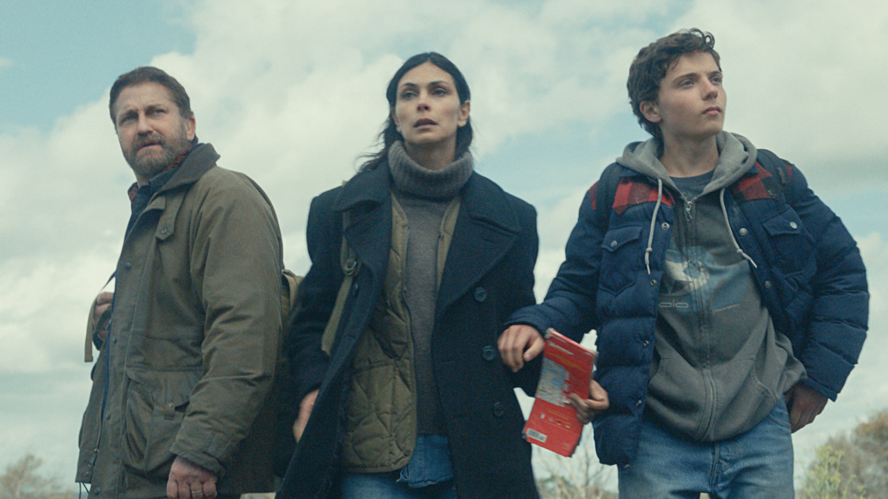 (L to R) Gerard Butler as John Garrity, Morena Baccarin as Allison Garrity, and Roman Griffin Davis as Nathan Garrity in 'Greenland 2: Migration'. Photo Credit: Courtesy of Lionsgate
