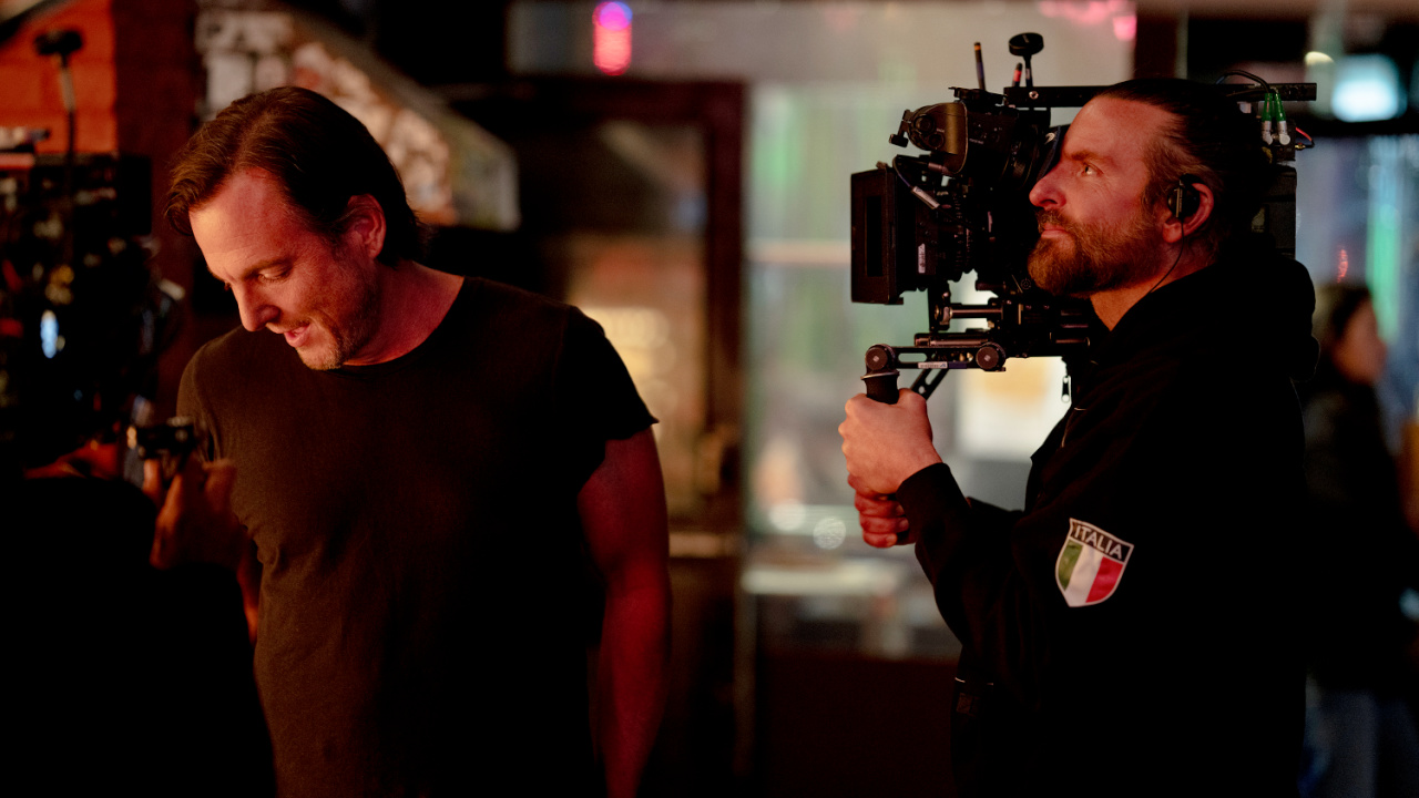 (L to R) Will Arnett and Bradley Cooper on the set of 'Is This Thing On?' Photo by Searchlight Pictures/Jason McDonald/ Courtesy of Searchlight Pictures. © 2025 Searchlight Pictures All Rights Reserved.