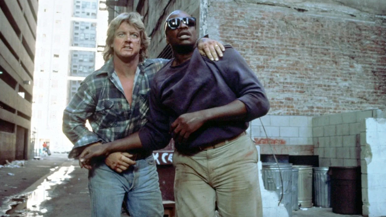 (L to R) Roddy Piper and Keith David in 'They Live'. Photo: Universal Pictures.