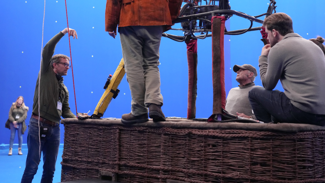 (L to R) Director Claudio Fäh, Hera Hilmar and Jeremy Irvine behind the scenes of the action thriller 'Turbulence', a Lionsgate release. Photo courtesy of Lionsgate.