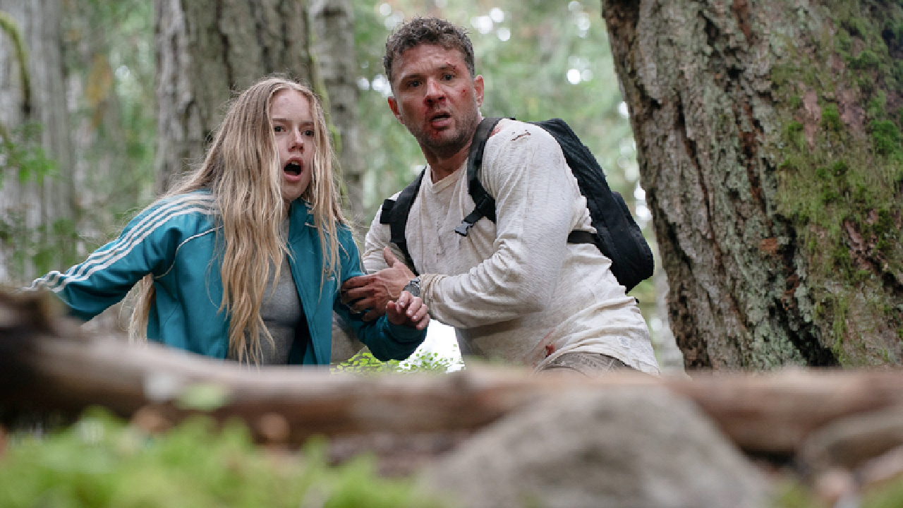 (L to R) Amélie Hoeferle as “Alex” and Ryan Phillippe as “Danny” in the Action, Thriller, Suspense film, 'One Mile: Chapter One' and 'One Mile: Chapter Two'. Photo courtesy of Republic Pictures (a Paramount Pictures label).