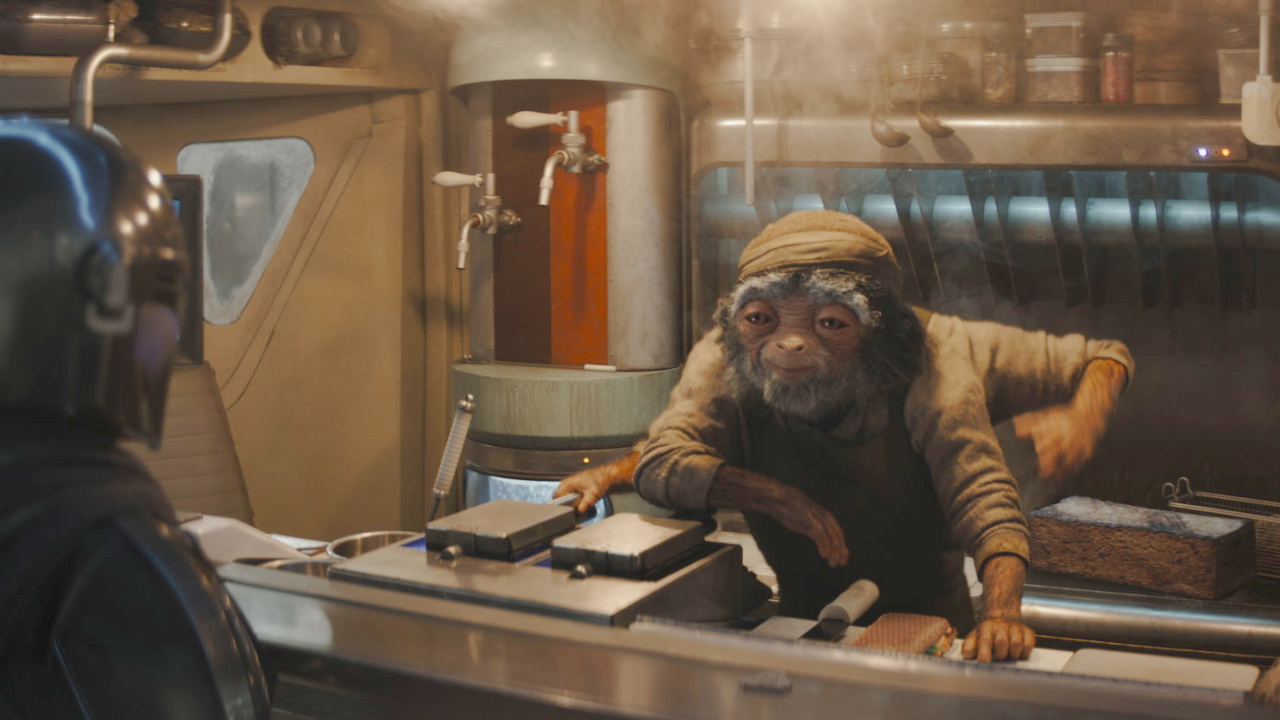 (L to R) The Mandalorian (Pedro Pascal) and Fry Cook in Lucasfilm's 'The Mandalorian and Grogu'. Photo courtesy of Lucasfilm. © 2026 Lucasfilm Ltd™. All Rights Reserved.