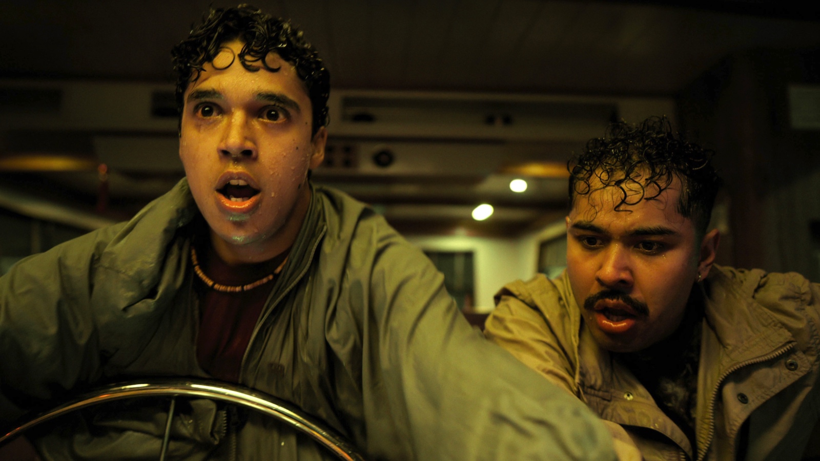 L to R) Benny Emmanuel as Wirpul, Kristyan Ferrer as Candi in Contra el Huracán (Surviving Hurricane Otis). Photo: Netflix ©️2026.